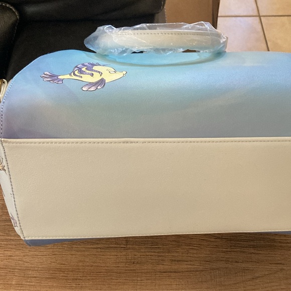 Ariel, sitting under moon satchel, lounge, fly purse - Picture 9 of 11